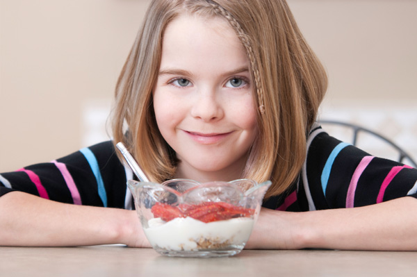 tween-girl-eating-yogurt